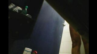 A girl washes herself in the shower, but there is a camera