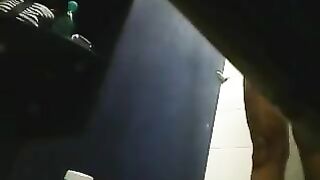 A girl washes herself in the shower, but there is a camera