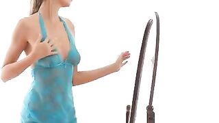 A hot chick is doing erotic moves in front of the mirror