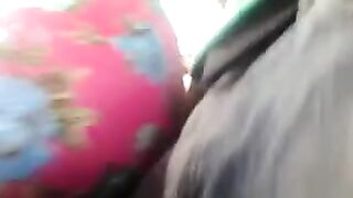 A guy is jerking off on the riser while women are passing by