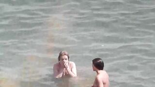 Bunch of wet pussies of naked girls on the beach after swimming