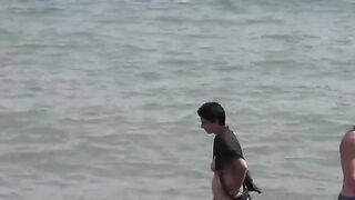 Bunch of wet pussies of naked girls on the beach after swimming