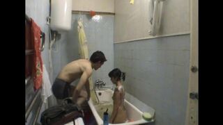 A girl has sex with her stepbrother in the bathroom, hidden from others