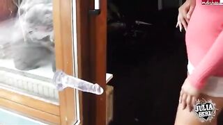 A cute girl plays with a dump truck and her big boobs
