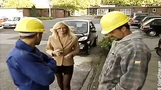 Girl in black pantyhose is actively sucking cock on the set