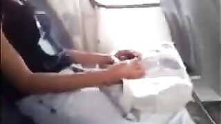 A handsome guy masturbates with his huge dick in front of a girl