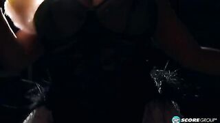 A fat woman in black underwear performs a sensual burlesque dance