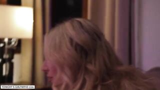 Busty blonde Kayley Gunner gives a foot job while wearing sexy stockings