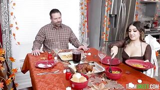 A delicious girl is serving a cock through the tablecloth on the table