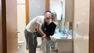 A couple has sex in the bathroom, with the guy cumming on the girl's boobs