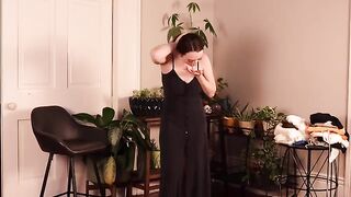 A girl tried on new clothes and became very excited