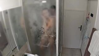 A couple has an intense encounter in the shower, caught up in the raw passion of the moment