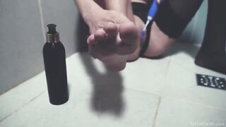 A girl has sex in the shower with a toy, embodying erotic power