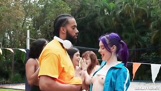 A girl is having fun with a guy in the yard