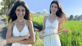 A sweet girl is picking rice and getting fucked outdoors