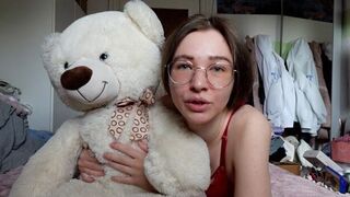 A cute girl has fun with her favorite teddy bear friend