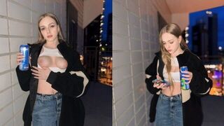 A cute girl showed more than her tits for a can of energy drink