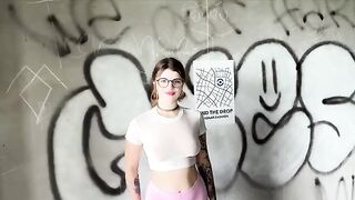 The girl is celebrating getting a home in an unfinished building