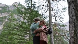 A couple engaged in passionate sex right in the forest