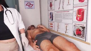 A doctor conducts a thorough oral examination of a fake hospital patient