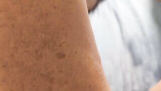 She plays with her pussy and reaches a squirting orgasm