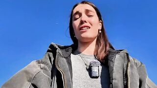 A petite teen bares all on the public beach to masturbate