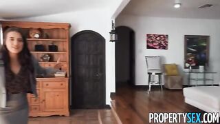 A girl is showing a luxurious house to her potential buyer, convincing him to buy it